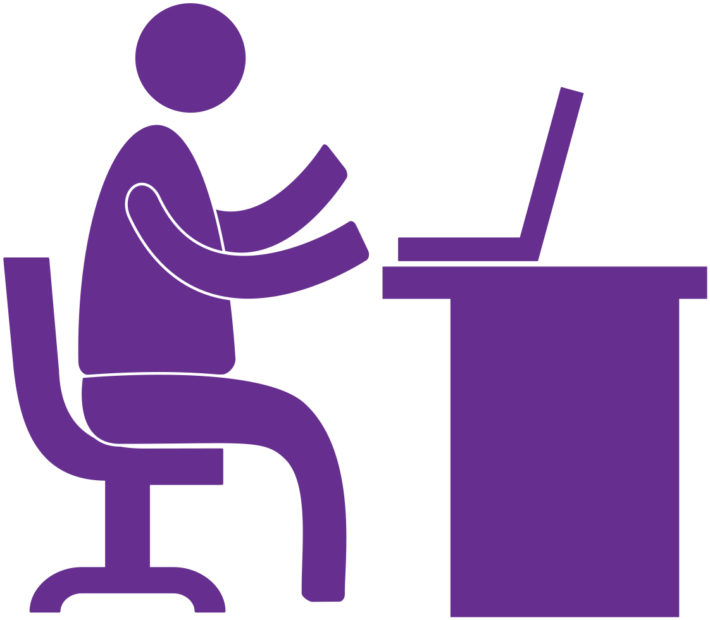 character seated at a desk with a computer